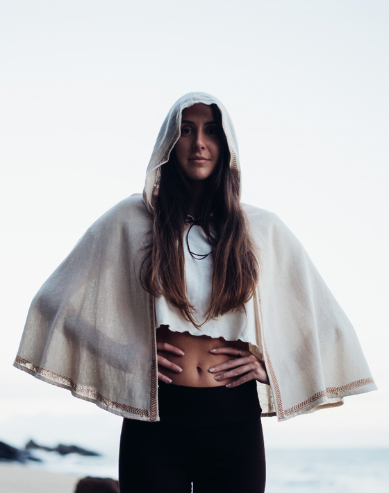 This unique artisanal cape adds a touch of boho-chic to any wardrobe.
