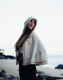  This unique artisanal cape adds a touch of boho-chic to any wardrobe.
