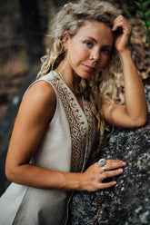 Crafted with earthy, muted tones and adorned with tribal block prints, this vest is crafted from 100% pure cotton, a resilient natural fiber.