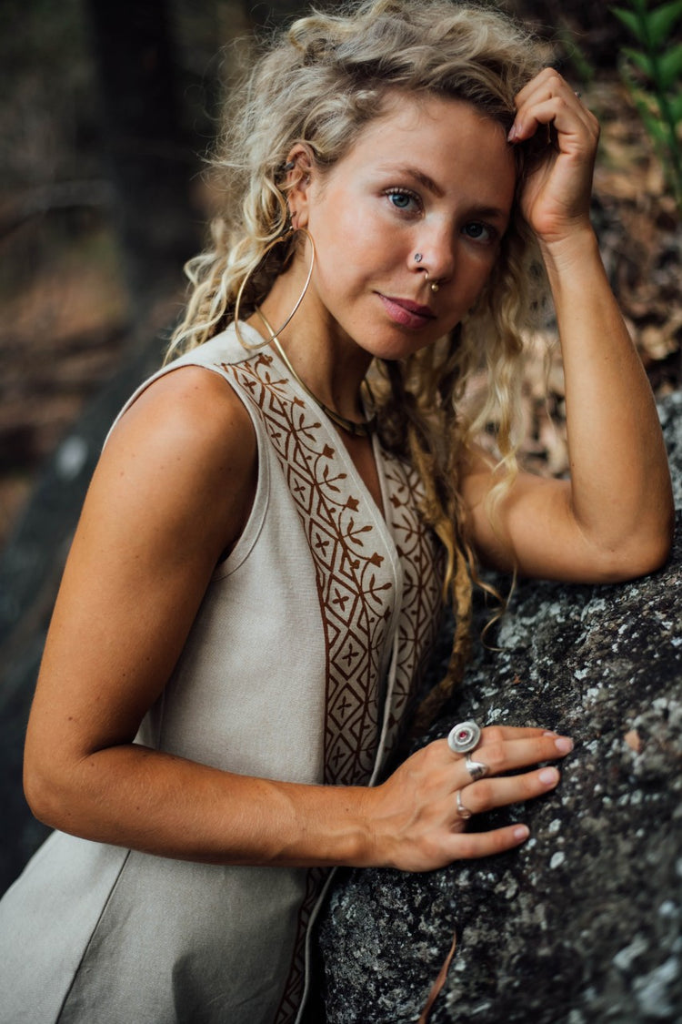 Crafted with earthy, muted tones and adorned with tribal block prints, this vest is crafted from 100% pure cotton, a resilient natural fiber.